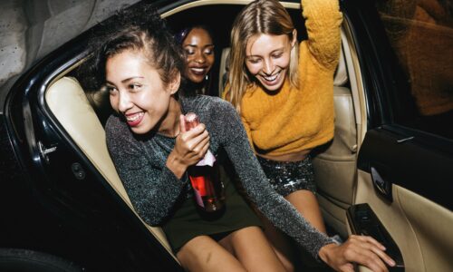 Diverse Women in a backseat of Lake Travis Limo Car