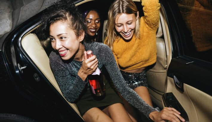 Diverse Women in a backseat of Lake Travis Limo Car